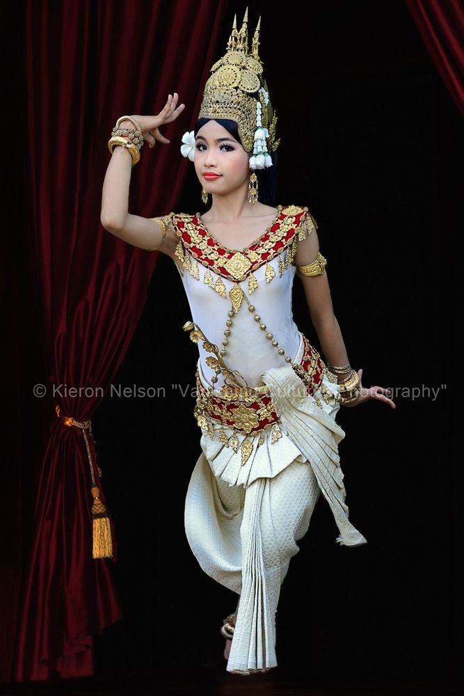 An Apsara Dancer from Cambodia in a traditional dance pose. Khmer classical dancers use stylized movements and gestures to convey meaning and tell a story. These gestures are often vague and abstract while some may be easily understood. The apsara, a woodland spirit, is played by a woman, sewn into a tight-fitting traditional dress whose graceful, sinuous gestures are codified to narrate classical myths or religious stories. The tradition of dance, honed for over a millennium, was almost lost in the Cambodian genocide when the Khmer Rouge targeted those involved in the dance and "imposed a massive cultural forgetting". In 2003, UNESCO declared the dance a "Masterpiece of Oral and Intangible Culture", and laid plans for a regeneration of the art form.