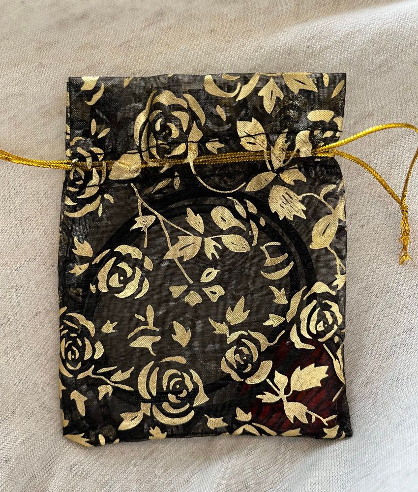 Smyckespåse i svart och guld
