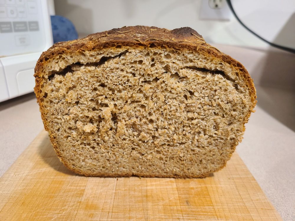 The loaf cut open, revealing the crumb (and some internal tear marks from me getting it out of the pan).