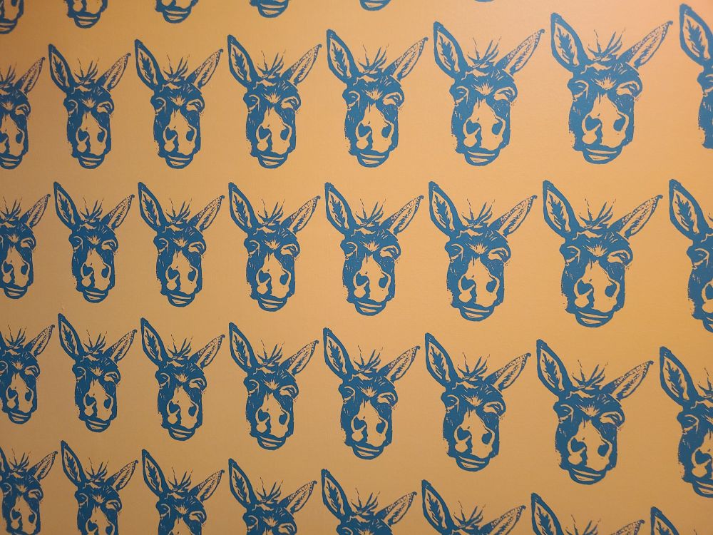 Bathroom wall decor of many donkeys