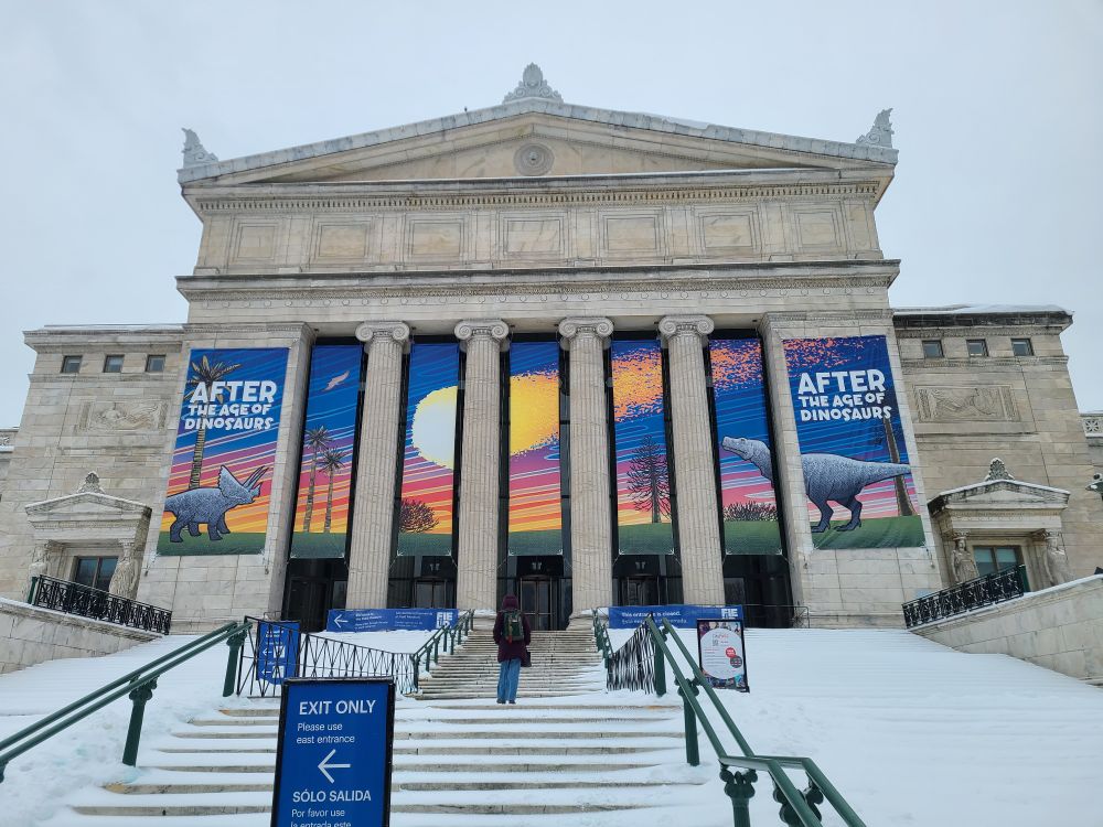 Entrance to the Field Museum. A huge display banner of a meteor crashing for the exhibit "After the age of Dinosaurs"