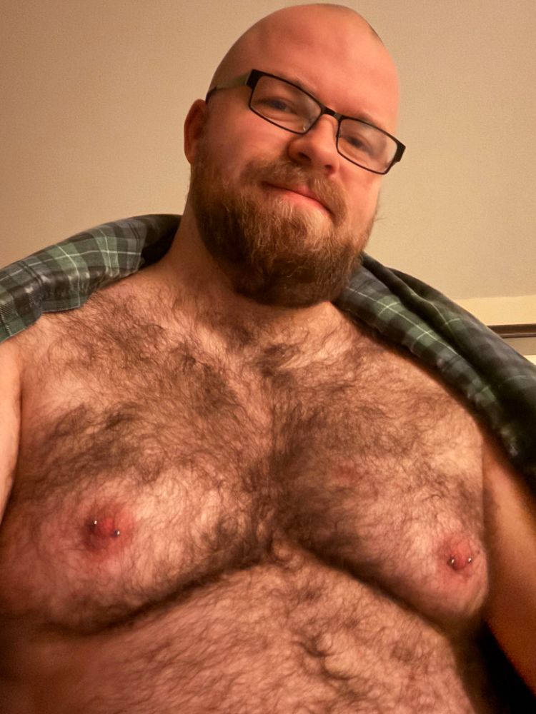 Selfie from the torso up. I’m shirtless with a blanket wrapped around my shoulders