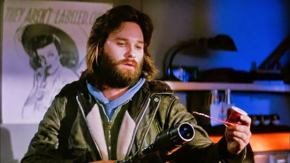 kurt russell testing blood to determine if someone is human or THE THING