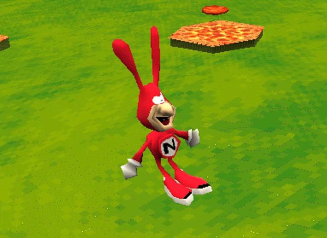 a red rabbit with the letter n on its chest is standing in the grass