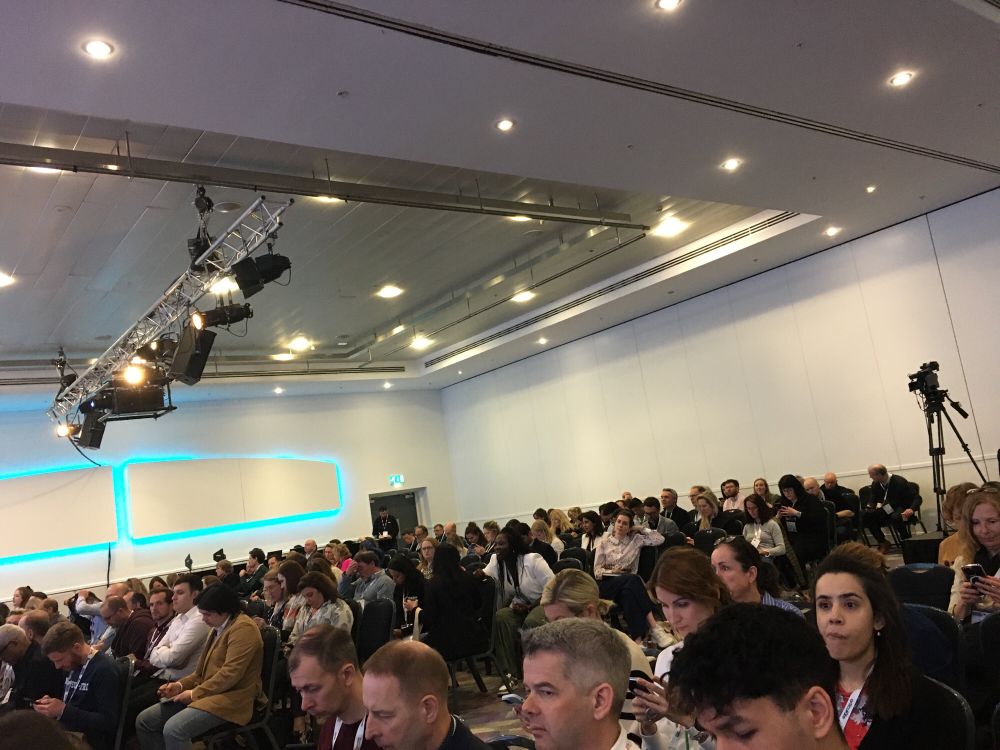 Packed audience in a conference hall