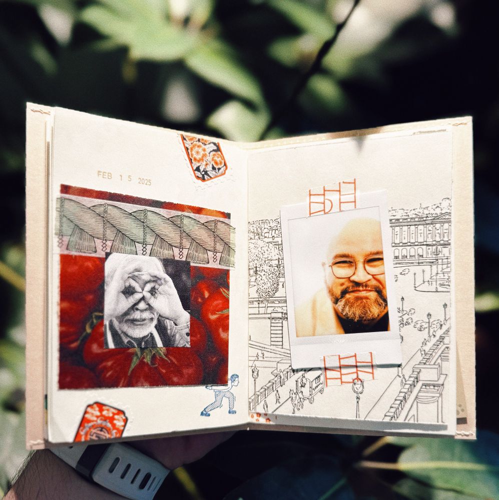 A person holds an open scrapbook outdoors with green foliage in the background. The left page contains a collage featuring a black-and-white photo of Hayao Miyazaki making binoculars with his hands, surrounded by red tomatoes, a patterned strip resembling banknotes, and a small stamp of a doodle of a figure holding the photo. The date “Feb 15 2025” is stamped on the page. The right page has a hand-drawn cityscape with an instant film photo of a smiling bald man with glasses taped over it, along with red geometric markings resembling ladders. The scrapbook pages appear textured and slightly worn.