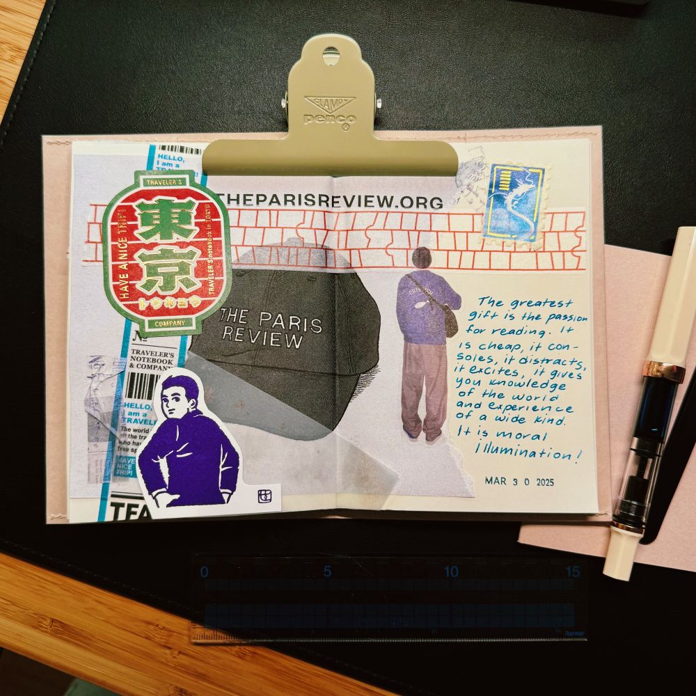 A creative collage spread in a Midori notebook, held open with a beige Penco clip. The spread features various elements including a sticker with Japanese text in a bold red and green, a black cap with “THE PARIS REVIEW” embroidered on it, a stylized illustration of a man in purple, a quote about the power of reading handwritten in blue ink, and a stamp with a dragon design. The date “MAR 30 2025” is stamped near the quote. A fountain pen rests on the right side of the notebook, and a ruler is placed at the bottom of the image on a wooden surface.

The quote says: The greatest gift is the passion for reading. It is cheap, it consoles, it distracts, it excites, it gives you knowledge of the world and experience of a wide kind. It is moral illumination!