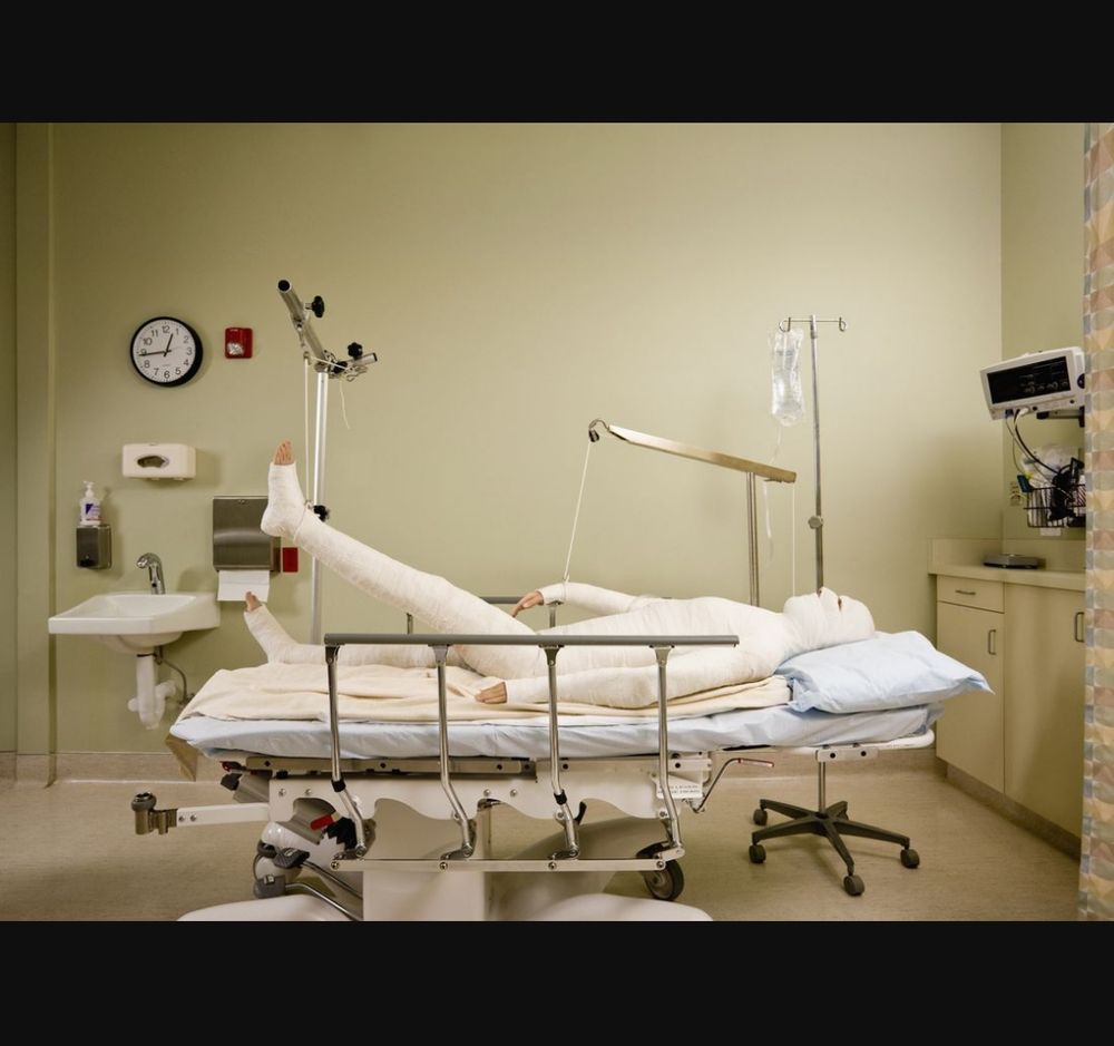 Bandaged up patient in traction