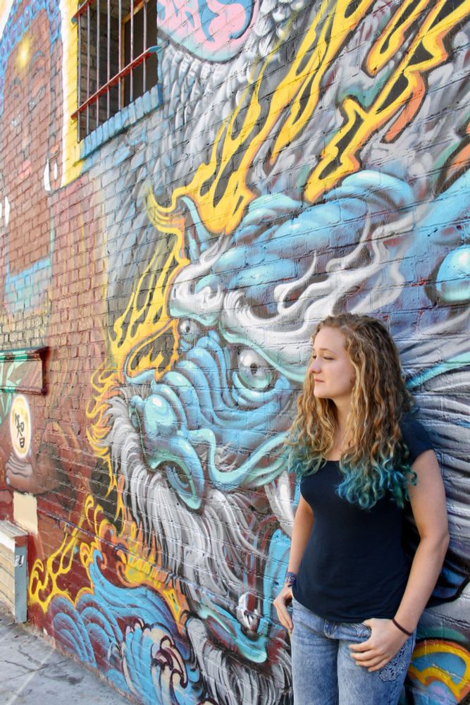 My daughter and a dragon mural 