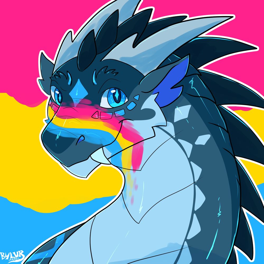 Bylue, a blue dragon, is looking at the camera. He has a grin with his snaggle tooth sticking on on the left side of his face. He has the pan flag painted on his snout. The background is also the pan flag (blue, yellow, pink)
