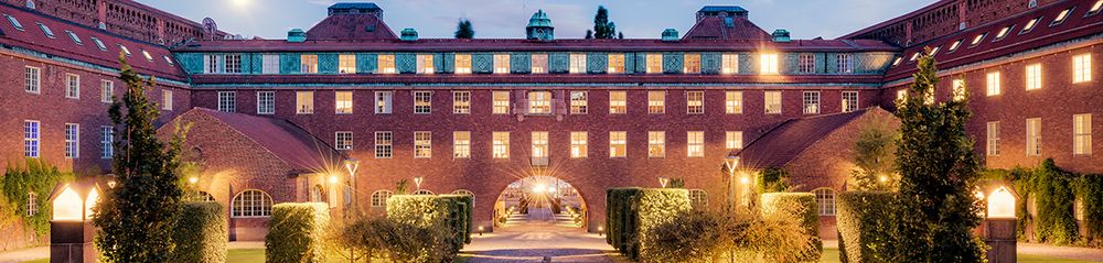 Picture of the Royal Institute of Technology Building in Stockholm, a brick building with gardens