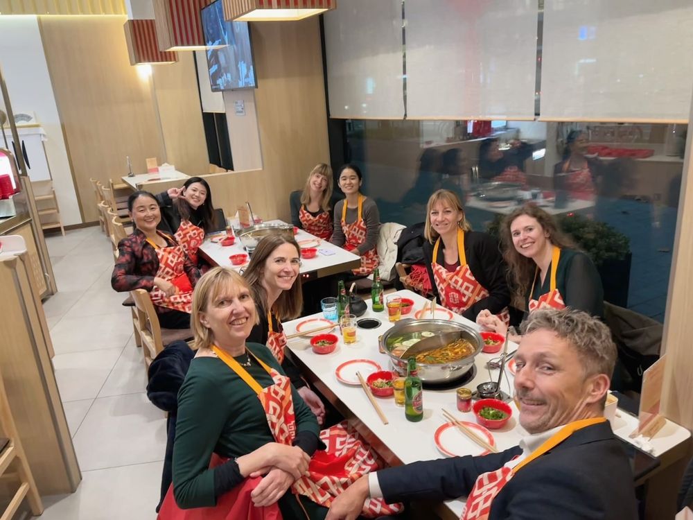 Chinese hotpot dinner, wearing aprons to limit the damage of clumsy chopstick dipping 
