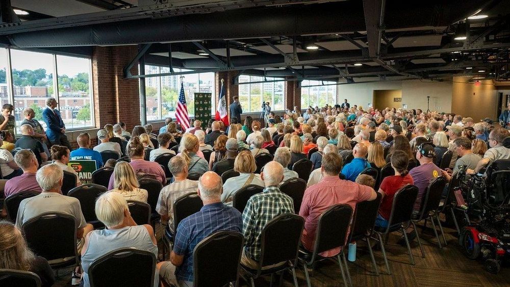 Rob Sand speaking to a room full of supporters.