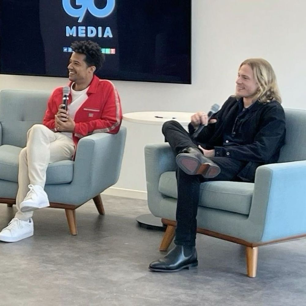 An image of Jacob Anderson and Sam Reid doing press for season 1 of Interview with the Vampire. They are sitting in large, separate armchairs, but in such a way that they’re as close to each other as physically possible, visibly leaving space on the other side of their respective armchairs.