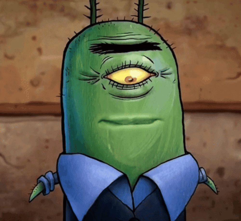 a green cartoon character with a yellow eye