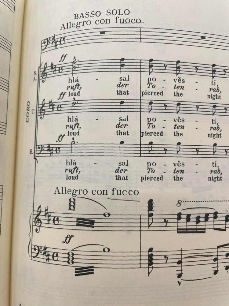 Sheet music for a piece of choral music with libretto in Czech, German and English.  Tempo is marked: Allegro con fucco