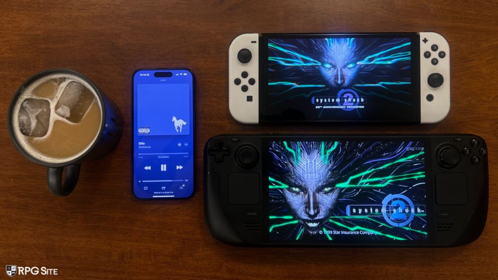 An iced latte, next to Deftones' Elite on Apple Music on an iPhone, System Shock 2 (classic) on Steam Deck, and an image of the 25th Anniversary Remaster on Switch. 