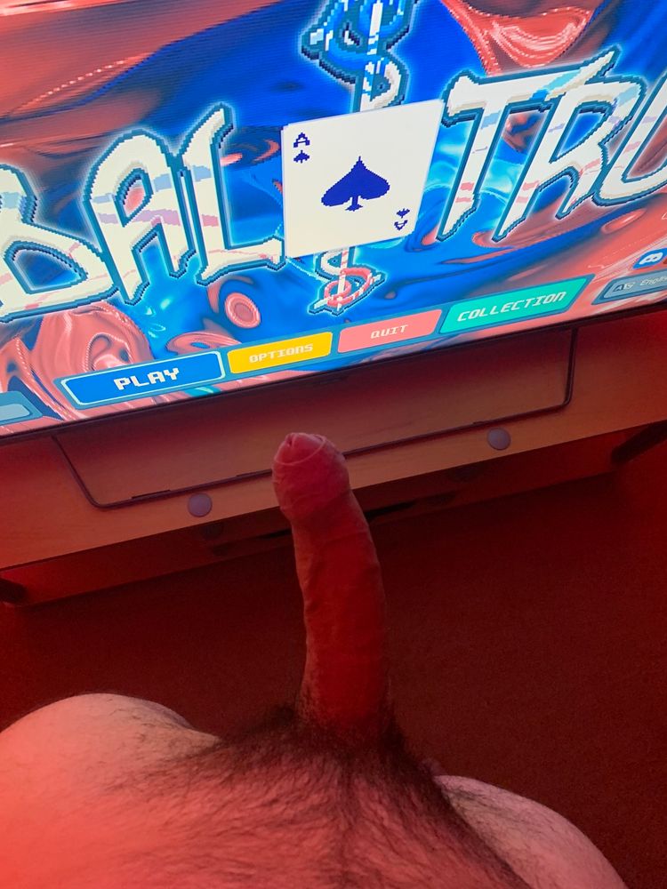 POV shot of my erect dick as I stand in front of a TV with the title screen of the video game Balatro on it