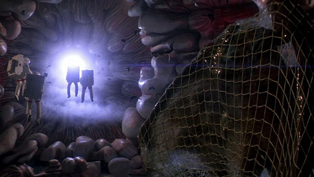 The crew of the USS Churchill entering the mysterious alien spaceship hiding in Halley's Comet in LIFEFORCE (Tobe Hooper, 1985)