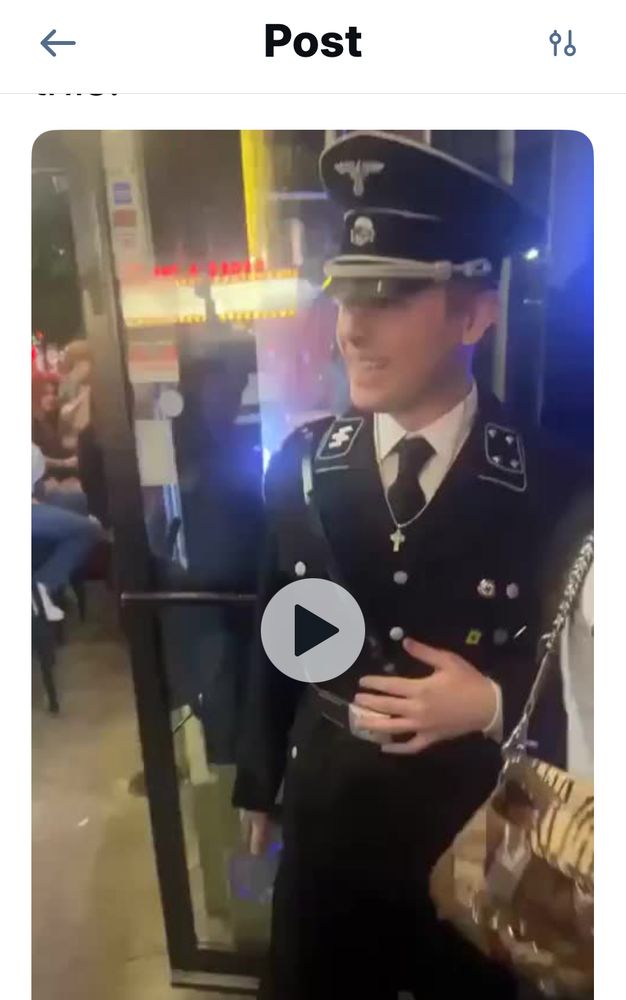 Screenshot still of the video going around of that loser in a Nazi costume who thought he could go out to the bar dressed like that. 