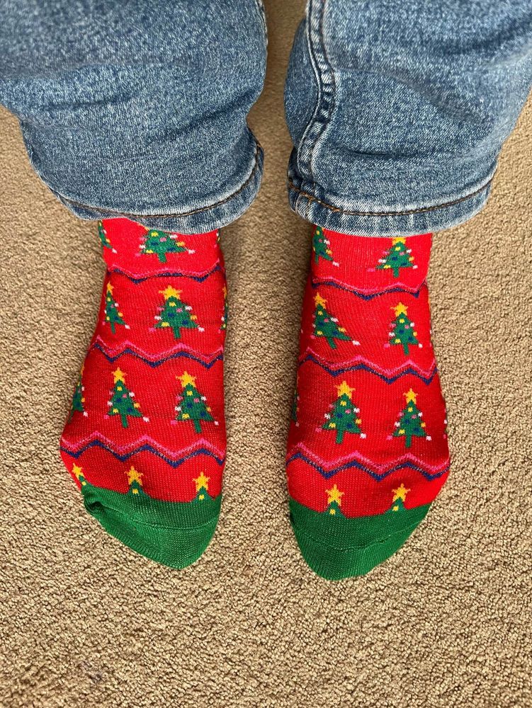 Red Christmas socks with lines of Christmas trees