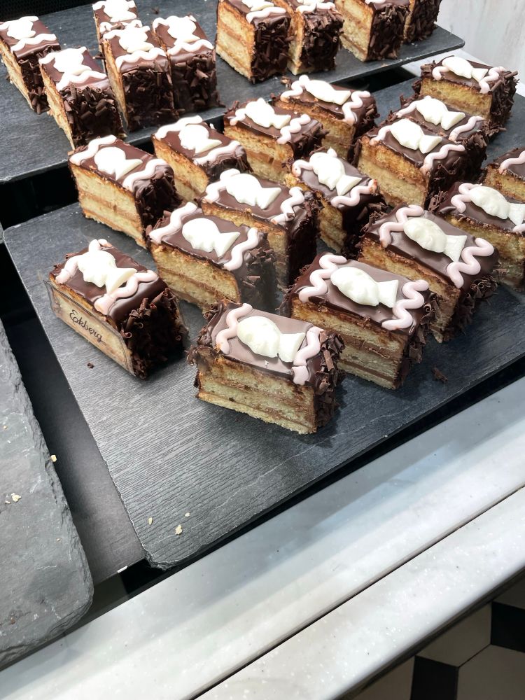 Gustavus Adolphus pastries. The profile of the King is white chocolate on a layered cake with chocolate icing. Some of the Kings look more like anime twinks