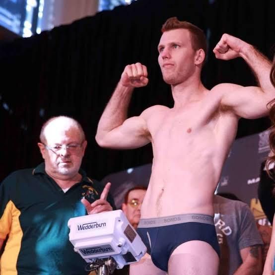 Brisbane teacher and boxer Jeff Horn in his bonds briefs furing a boxing match weigh-in.