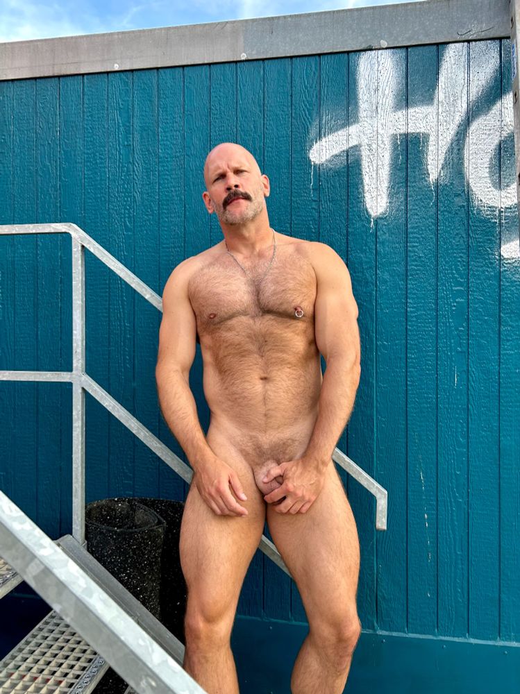 Naked man against a blue background