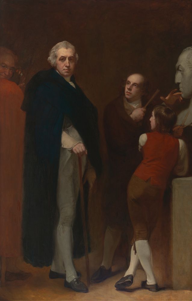 Romney’s Flaxman Modelling the Bust of Hayley. On the left, Romney’s face, wearing small round spectacles, can be seen smirking (self-portait). Next to him is Hayley looking larger than life and very grand in a kind of cape, facing out of the picture, right leg slightly forward and posing with a walking stick. Flaxman (whose head comes up to Hayley’s shoulder, is looking up at his subject, while modelling and almost Easter Island-sized head, while Hayley’s son, shorter still, is viewed from behind, legs crossed, brown hair down to his shoulders, looking to his left at his father. 
George Romney, 1734–1802, John Flaxman Modeling the Bust of William Hayley, 1795 to 1796, Oil on canvas, Yale Center for British Art, Paul Mellon Collection, B1981.25.538.