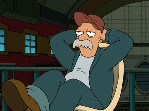 A man in a canadian tuxedo reclined in a chair with his feet on a table