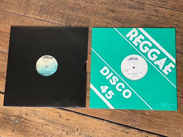 Photograph of two Lion Youth 12"s on Virgo Stomach: "Rat A Cut Bottle" (VG 104) and "Three Million On The Dole" (VG 013).

Both produced, like the “Love Comes And Goes” album, by John Rubie.

Apologies for poor quality photos!