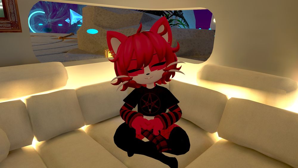 Chili sitting cross-legged on couch