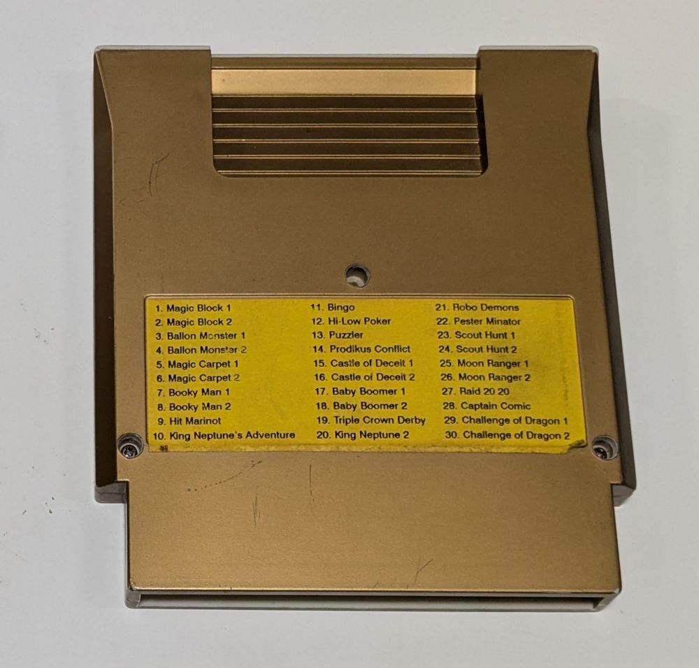 Photo of the back of the same prototype cartridge. The back side has a game list sticker.