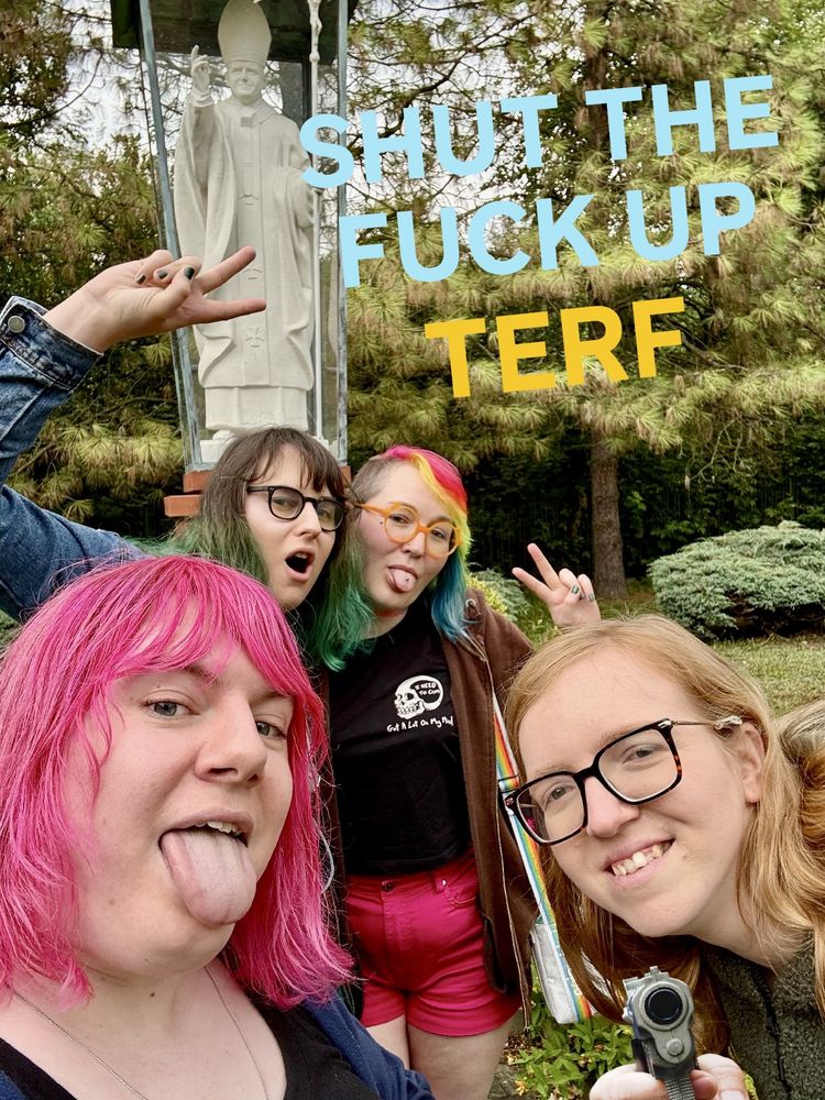 Vesper, Sami, Asia and Brie at a John Paul 2nd statue being very disrespectful. Asia is holding a gun. Shut the fuck up, terf