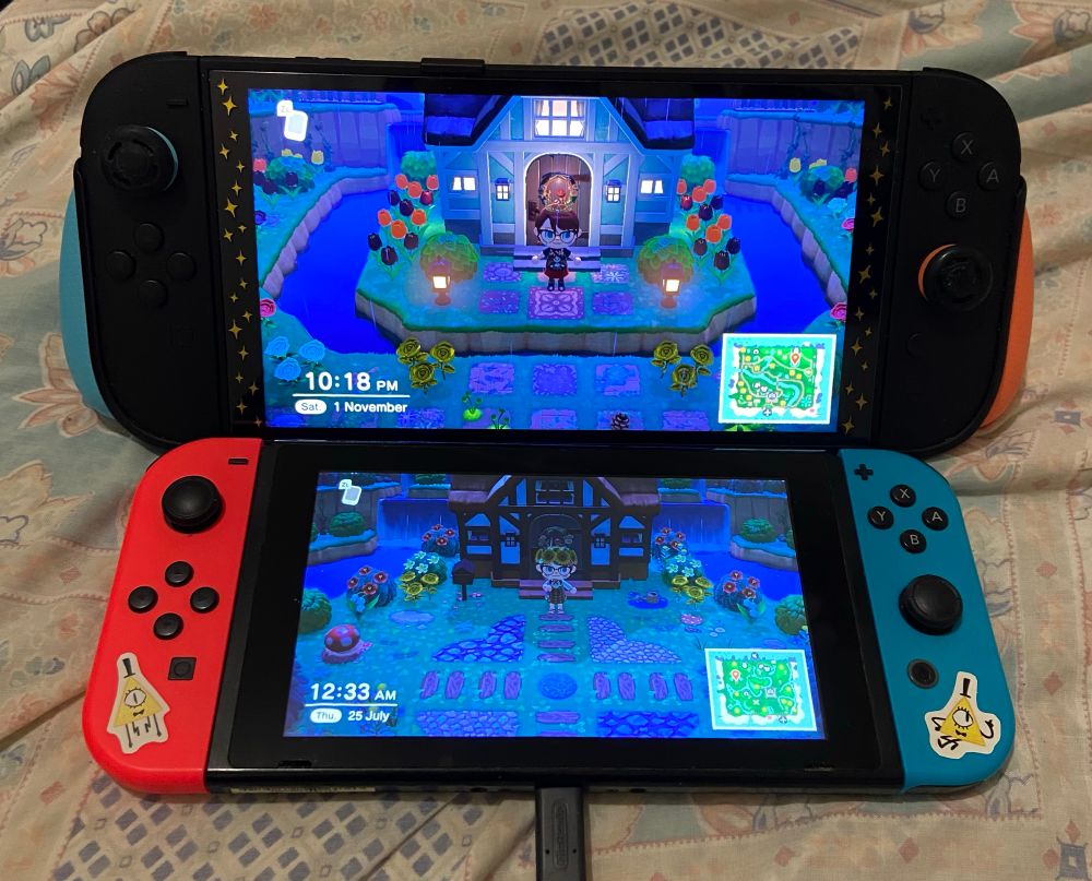 A photo of my Switch 2 playing my main Animal Crossing New Horizons island above my original 2017 Switch which houses my second island.