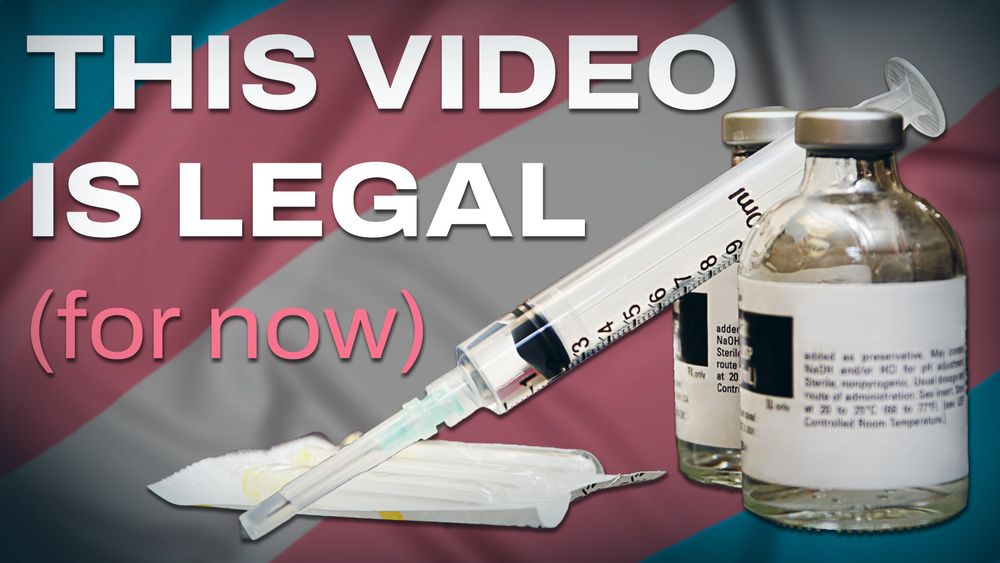 YouTube thumbnail featuring a syringe propped up between two vials of medication. Text reading "THIS VIDEO IS LEGAL (for now)". The backdrop is a trans flag.