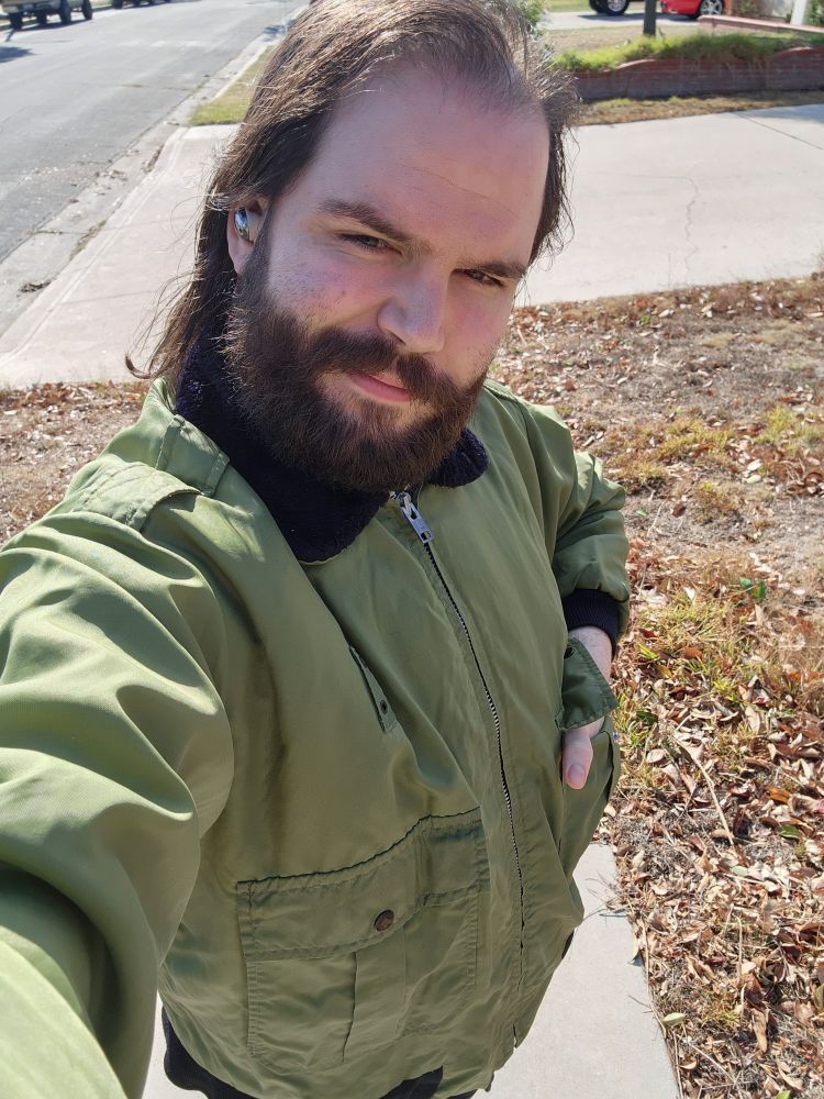 Me wearing a green bomber jacket