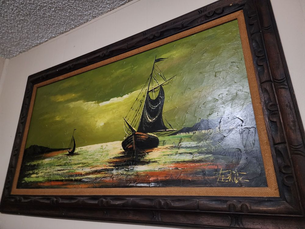 A green sky over black boats on a calm sea with rust red highlights, implying an impending typhoon