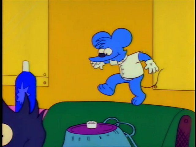 Itchy kicks away Scratchy's severed head. 