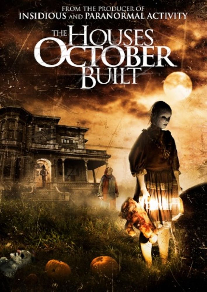 movie poster for the houses that october built. a creepy doll like girl stands in front of a haunted house holding a teddy bear