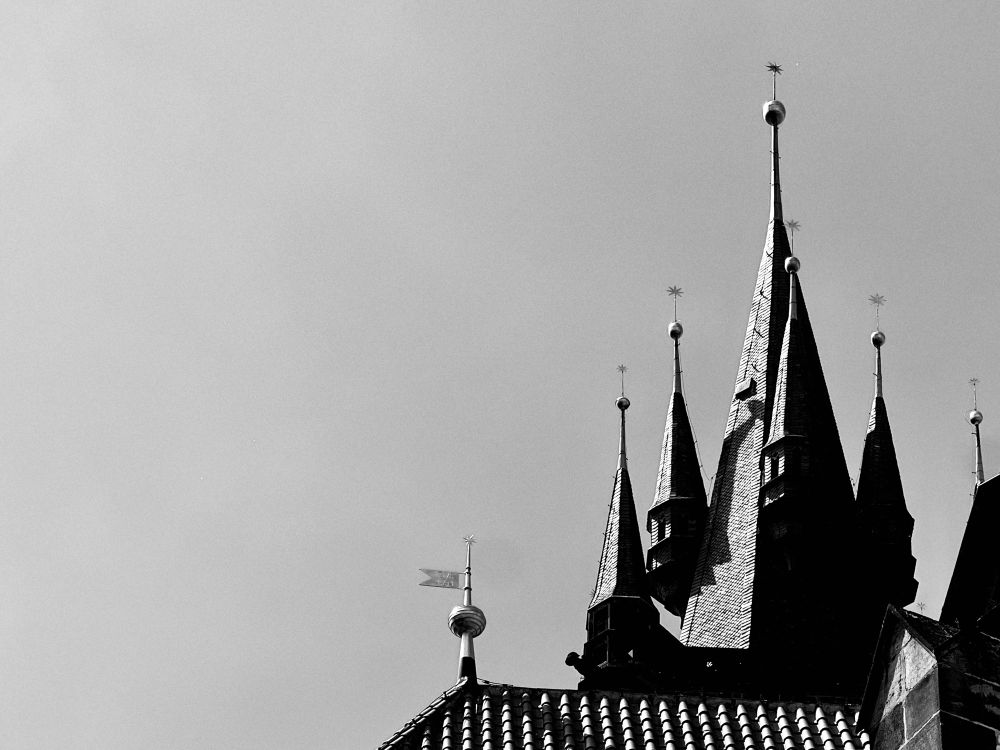 B/w photo of the spiky bits on the top of the cathedral in the centre of Prague. It looks very gothic. Very contrasty. 