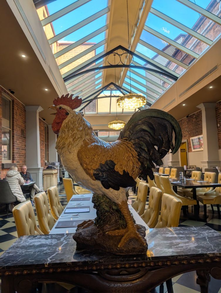 A large sculpture of a rooster at the entrance to the dining area of an historic hotel in Ballarat, VIC