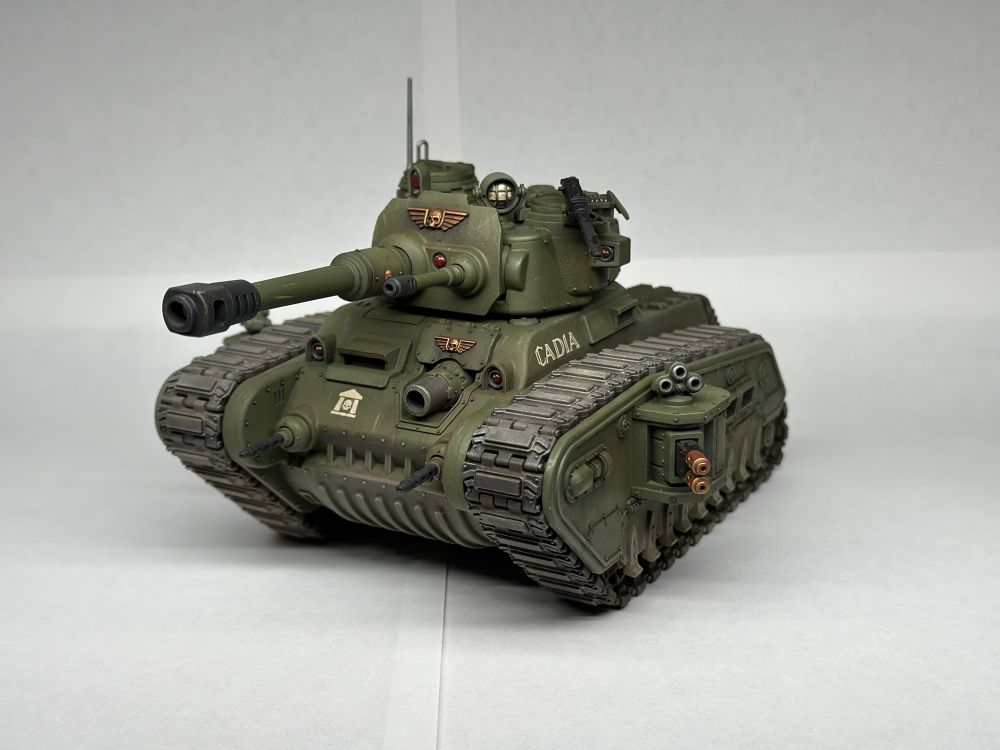 Rogal Dorn Battle Tank from Warhammer 40,000, painted drab green with gold accents