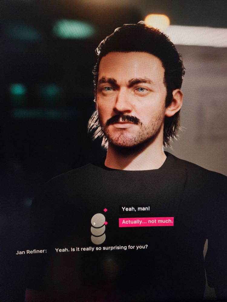 Jan Dolski is talking to the Refiner version of himself in the video game The Alters. He is choosing a conversation option that implies he's not surprised to learn an alternate version of him has had a same-sex love. Jan Refiner has one of those slightly shaggy hairstyles with a topknot that would have screamed "the bi one" if it wasn't already text