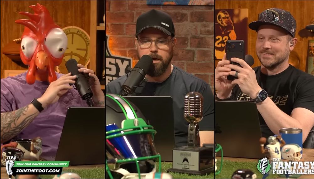 Mike Wright is a chicken. He reaches out to find his microphone. Jason focuses on his picks while Andy laughs and laughs and takes a picture. 