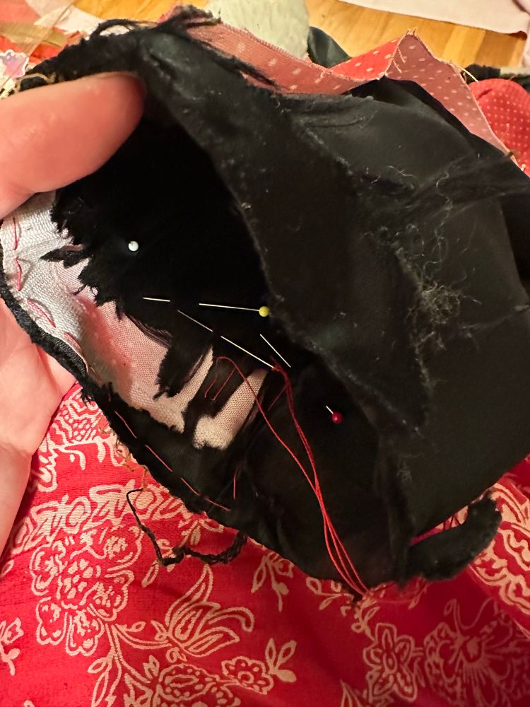 Me basting a very shredded lining to some quilting cotton to keep it from shifting and wadding. 