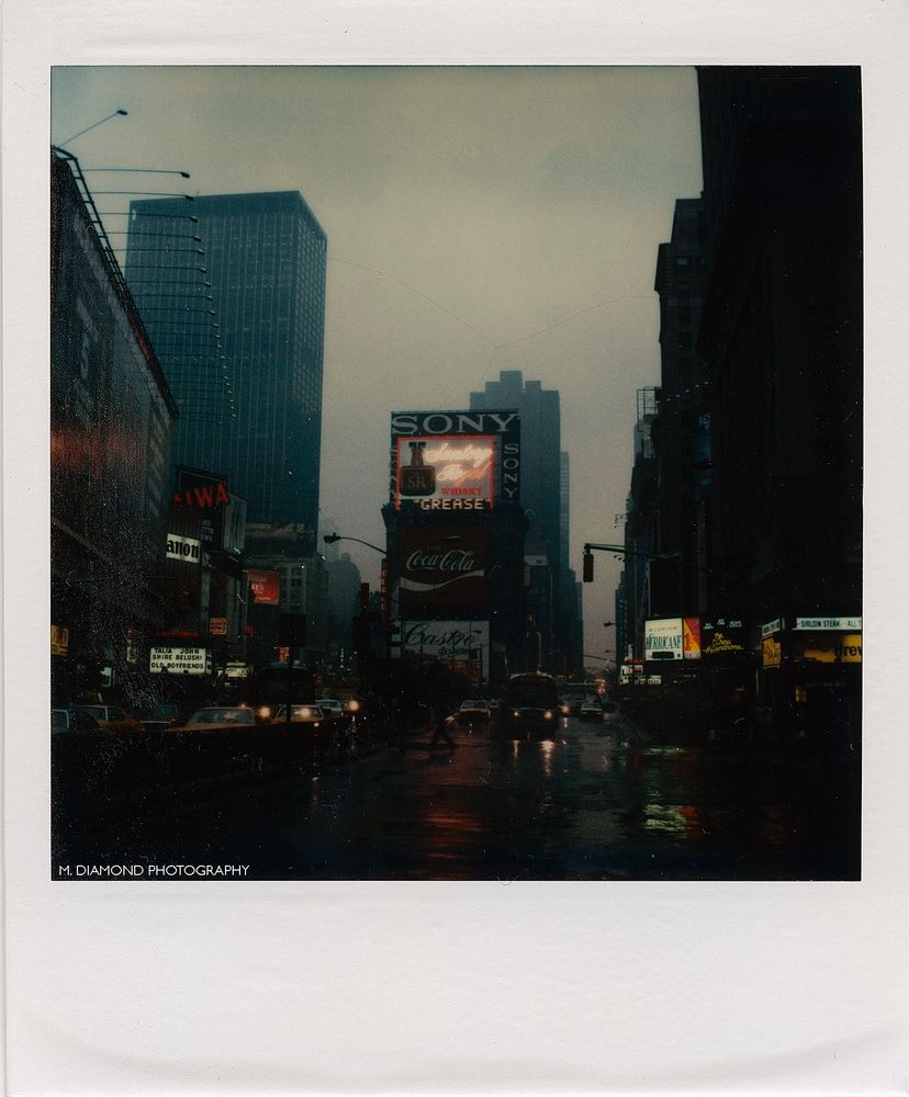 Times Square, NYC in the rain at night.