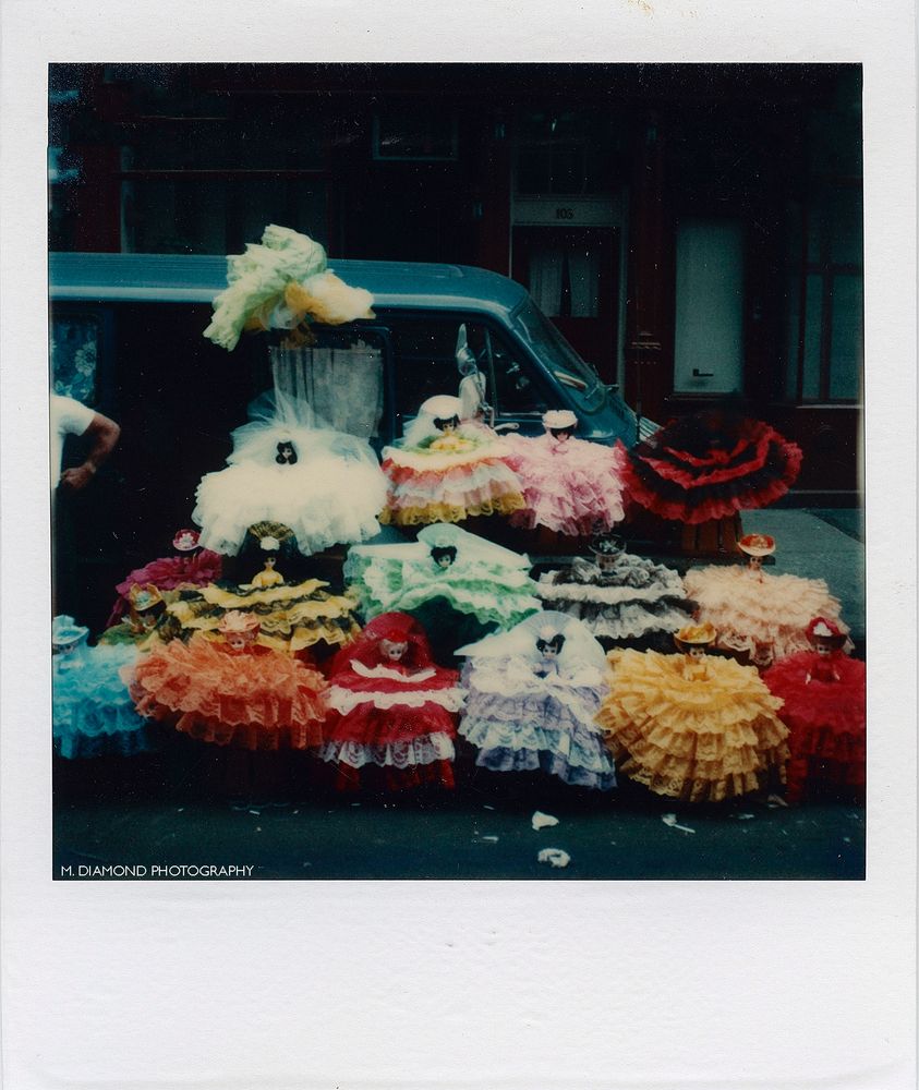 Street vendor selling colorful dolls from his car in Manhattan.
