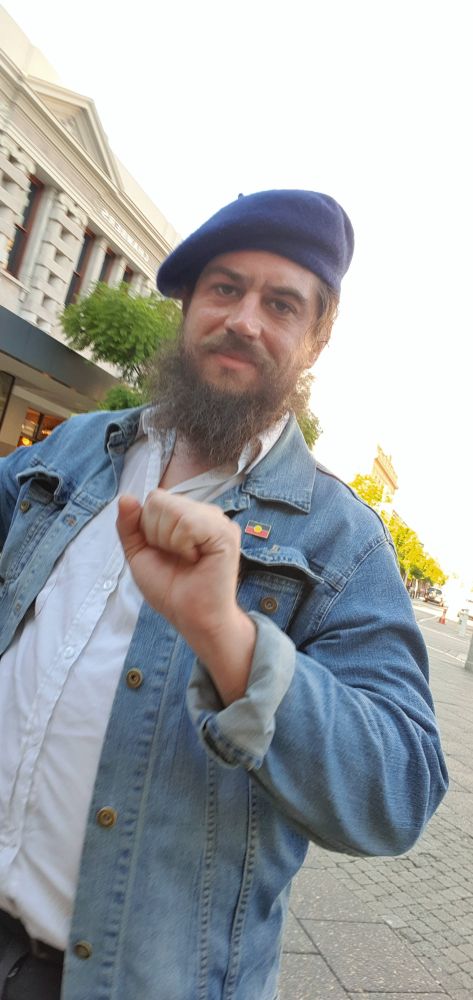 vidak doing the socialist fist symbol salute.