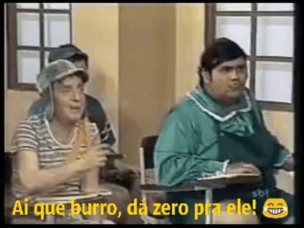 two men are sitting at desks in a classroom with the words `` ai que burro , da zero pra ele '' .